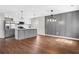 Open concept kitchen with stainless steel appliances and an island with bar seating at 1104 Oak Knoll Se Ter, Atlanta, GA 30315