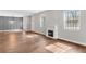 Cozy living room featuring modern fireplace, hardwood floors and lots of natural light at 1104 Oak Knoll Se Ter, Atlanta, GA 30315