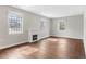 Bright living room showcasing recessed lighting, a fireplace, and windows with security bars at 1104 Oak Knoll Se Ter, Atlanta, GA 30315