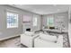 Staged living room with modern decor, fireplace and ample natural light at 1104 Oak Knoll Se Ter, Atlanta, GA 30315
