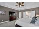 Large primary bedroom featuring neutral wall color, a TV and a lovely dresser at 1460 Badingham Dr, Cumming, GA 30041