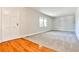 Bright and airy living room with hardwood floors and neutral carpet at 3549 Creatwood Se Trl, Smyrna, GA 30080