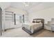 Inviting bedroom with large windows and built-in shelving. The bedroom is well-lit with natural light at 607 Crimsonwood Ct, Powder Springs, GA 30127