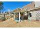 Well-maintained backyard with a covered patio and a manicured lawn at 1030 Whistling Swan Pl, Marietta, GA 30066