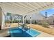Outdoor patio with a pergola, a table with chairs, and well-maintained lawn at 1030 Whistling Swan Pl, Marietta, GA 30066