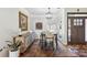 Elegant dining room with modern lighting, grey walls, and hardwood floors at 1030 Whistling Swan Pl, Marietta, GA 30066