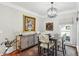 This elegant dining room features a modern chandelier, stylish chairs, and a unique art collection at 1030 Whistling Swan Pl, Marietta, GA 30066