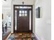 Front door entrance with rug and sidelights at 1030 Whistling Swan Pl, Marietta, GA 30066