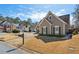 Charming single Gathering home with stone accents, manicured lawn, and two-car garage at 1030 Whistling Swan Pl, Marietta, GA 30066