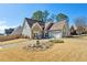 Charming single Gathering home with stone accents, manicured lawn, and two-car garage at 1030 Whistling Swan Pl, Marietta, GA 30066