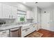Updated kitchen with white cabinets, a farmhouse sink, and stainless steel appliances at 1030 Whistling Swan Pl, Marietta, GA 30066