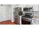 A modern kitchen with stainless steel appliances, ample counter space, and natural light at 1030 Whistling Swan Pl, Marietta, GA 30066