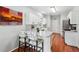 Modern kitchen with stainless steel appliances, a marble counter, and breakfast bar seating at 1030 Whistling Swan Pl, Marietta, GA 30066