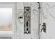 Close up of shower featuring rainfall shower head, a small frosted window, and glass shelving built into the shower wall at 1030 Whistling Swan Pl, Marietta, GA 30066