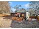 Backyard view of home with a wooden deck and a privacy fence, creating a private outdoor space at 2178 Penelope Nw St, Atlanta, GA 30314