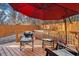 Backyard deck furnished with chairs and a table, and a wooden fence in the background at 2178 Penelope Nw St, Atlanta, GA 30314