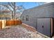 Home's backyard with a wooden privacy fence and additional storage for outdoor living at 2178 Penelope Nw St, Atlanta, GA 30314