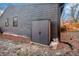 Side view of backyard with storage and wooden fence and dining set in the background at 2178 Penelope Nw St, Atlanta, GA 30314