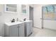 Modern bathroom with double sinks, updated fixtures, and tiled floors at 2178 Penelope Nw St, Atlanta, GA 30314