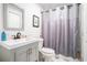 Bathroom featuring a new vanity with a modern faucet and a shower with gray shower curtain at 2178 Penelope Nw St, Atlanta, GA 30314