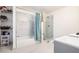 Bright bathroom showcasing shower over tub with marble and custom shelving unit at 2178 Penelope Nw St, Atlanta, GA 30314