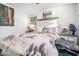 Cozy bedroom with a large bed, a nightstand with a lamp, and decorative wall art at 2178 Penelope Nw St, Atlanta, GA 30314