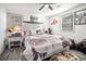 Comfortable bedroom with a ceiling fan, ample natural light, and wood-look floors at 2178 Penelope Nw St, Atlanta, GA 30314