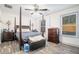 Bedroom with four-poster bed, ceiling fan, wood-look floors and light-filled windows at 2178 Penelope Nw St, Atlanta, GA 30314