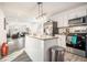 Modern kitchen features granite counters, stainless appliances, and an island with pendant lighting at 2178 Penelope Nw St, Atlanta, GA 30314