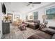Bright and airy living room with ample seating, a ceiling fan, and large windows at 2178 Penelope Nw St, Atlanta, GA 30314
