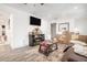 Spacious living area with a TV, a wooden cabinet, and cozy furniture at 2178 Penelope Nw St, Atlanta, GA 30314