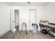 A functional office space with a modern desk and sleek gray hardwood floors at 2178 Penelope Nw St, Atlanta, GA 30314