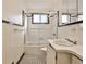 Classic white bathroom with black and white tile floors and shower and tub combo at 425 Lindbergh Ne Dr # A2, Atlanta, GA 30305