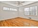 A bright bedroom featuring hardwood floors, a ceiling fan and multiple windows providing natural light at 425 Lindbergh Ne Dr # A2, Atlanta, GA 30305