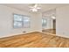 Bedroom with hardwood floors, ceiling fan, large window and a built-in mirror wall at 425 Lindbergh Ne Dr # A2, Atlanta, GA 30305