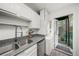 Well-lit kitchen with stainless steel sink and access to outdoor space at 425 Lindbergh Ne Dr # A2, Atlanta, GA 30305