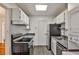 Efficient galley kitchen with stainless steel appliances and ample cabinet space at 425 Lindbergh Ne Dr # A2, Atlanta, GA 30305