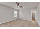 A carpeted bedroom featuring a ceiling fan and double-paned window for natural light at 619 Egrets Lot 48 Lndg, Covington, GA 30014