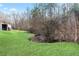 View of backyard with a stream and trees at 209 Sweetwater Trl, Villa Rica, GA 30180