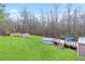 Spacious backyard featuring an above ground pool, deck, sheds and green lawn at 209 Sweetwater Trl, Villa Rica, GA 30180