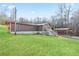 Exterior view of house featuring a front porch, a lawn, and a carport on the side at 209 Sweetwater Trl, Villa Rica, GA 30180