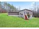 Charming home with a well-maintained lawn and classic exterior, surrounded by mature trees at 209 Sweetwater Trl, Villa Rica, GA 30180