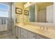 Bathroom featuring a double sink vanity, a window, and a shower with a tub at 4095 Oberon Se Ct, Smyrna, GA 30080