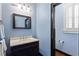 Powder room with elegant vanity, decorative mirror, and stylish lighting at 4095 Oberon Se Ct, Smyrna, GA 30080
