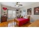 Sports themed bedroom featuring hardwood floors, natural light and ceiling fan at 4095 Oberon Se Ct, Smyrna, GA 30080