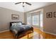 Inviting bedroom filled with natural light features hardwood floors and neutral walls at 4095 Oberon Se Ct, Smyrna, GA 30080