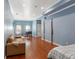 Large bedroom with a comfortable seating area, game table and ample natural light from the windows at 4095 Oberon Se Ct, Smyrna, GA 30080