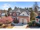 Charming two-story brick home with well-manicured landscaping and attached garage at 4095 Oberon Se Ct, Smyrna, GA 30080