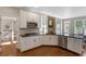 Well-equipped kitchen features stainless steel appliances, granite countertops, and light wood flooring at 4095 Oberon Se Ct, Smyrna, GA 30080