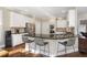Modern kitchen features white cabinets, stainless steel appliances, granite countertops, and breakfast bar seating at 4095 Oberon Se Ct, Smyrna, GA 30080